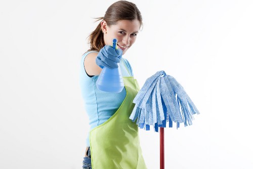 Cleaner preparing a home cleaning service checklist