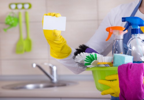 Cleaner preparing safe cleaning equipment and observing workplace safety